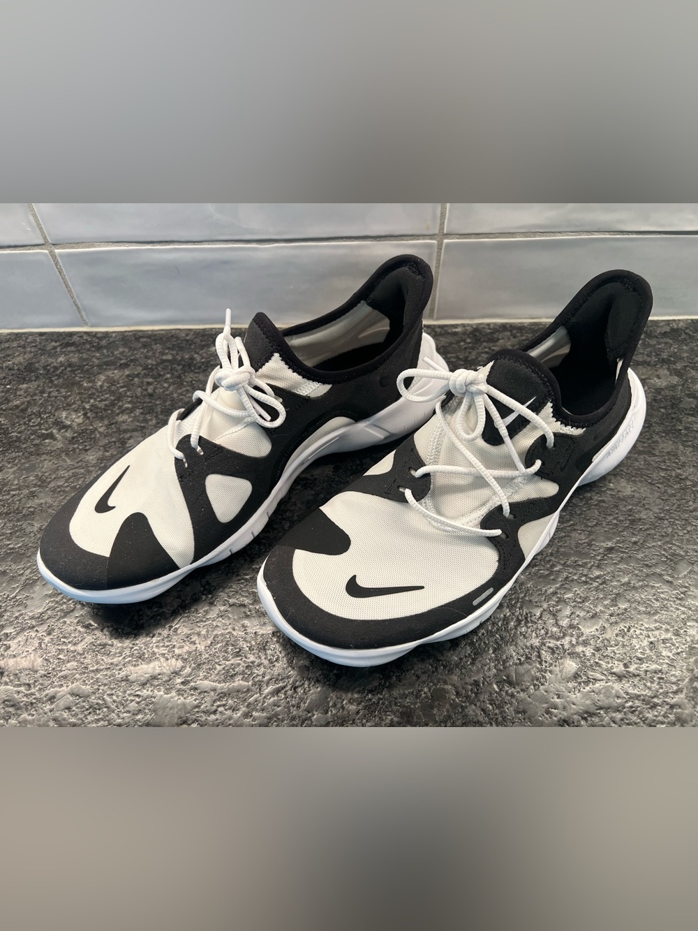 Nike Free brand Black and White Slip-On Performance Sneakers